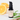 Annmarie Citrus Stem Cell Serum bottle sits next to fresh orange slices and green leaves.
