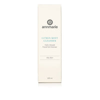 Annmarie Citrus Mint Cleanser, a herb-infused facial gel for oily skin, sits on a white surface.
