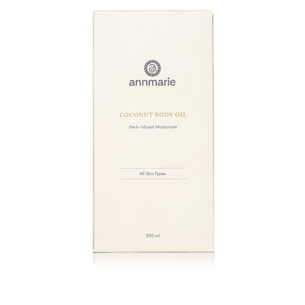 Annmarie presents its coconut body oil, a herb-infused moisturizer for all skin types, in a 200ml container.

