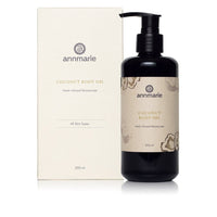 Annmarie presents coconut body oil and its box, advertising a herb-infused moisturizer for all skin types.
