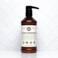 A bottle of Rustic Strength coconut conditioner promises to moisturize and strengthen normal to dry hair.
