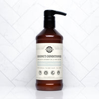 A bottle of Rustic Strength coconut conditioner promises to moisturize and strengthen normal to dry hair.
