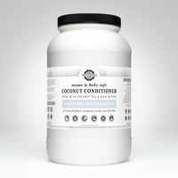 Examine a large container of Rustic Strength Mama & Baby Safe coconut conditioner, unscented and hypoallergenic, crafted with coconut oil and shea butter.
