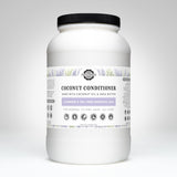 Examine a large container of Rustic Strength coconut conditioner with lavender and tea tree essential oils for normal to dry hair.
