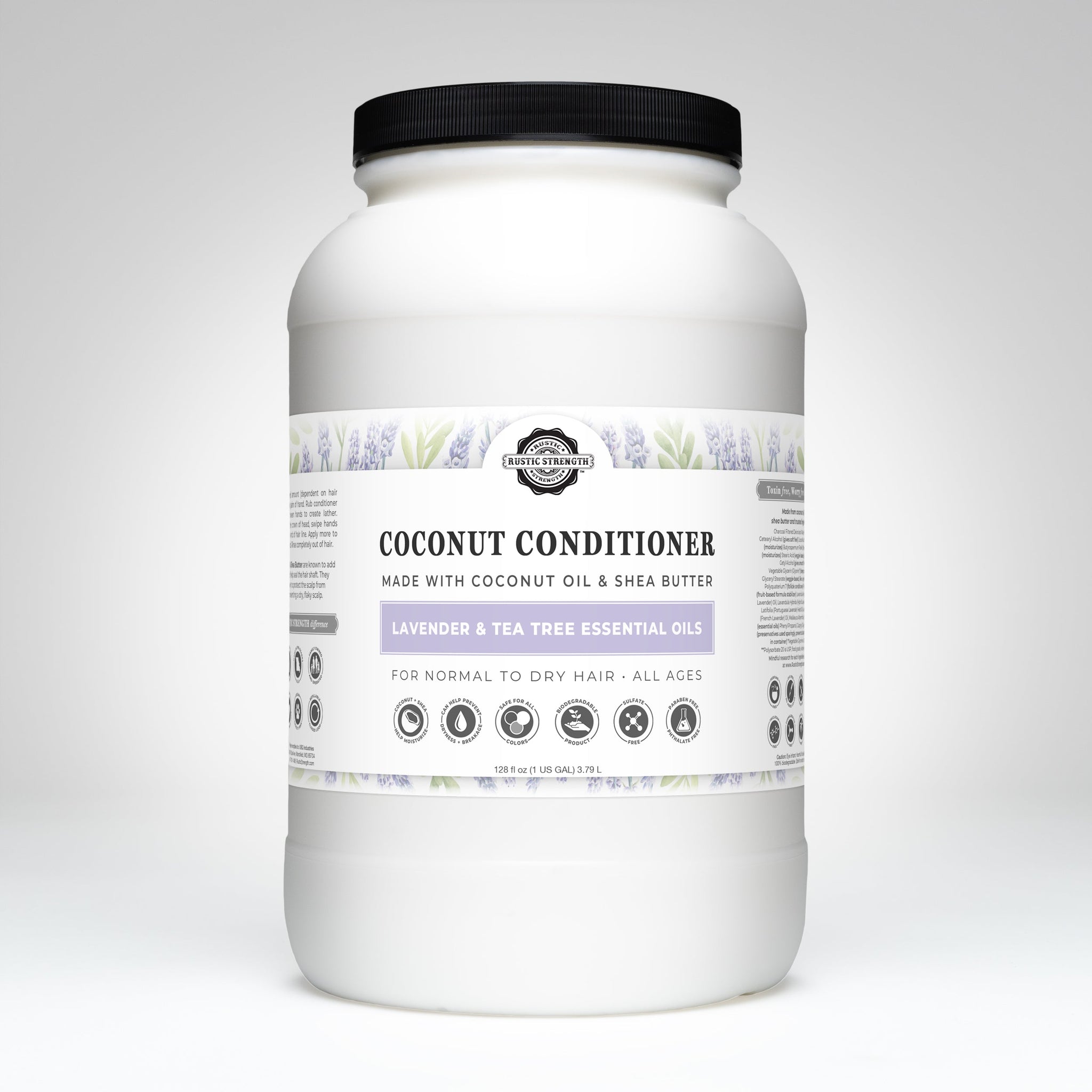 Examine a large container of Rustic Strength coconut conditioner with lavender and tea tree essential oils for normal to dry hair.
