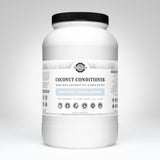 View shows a large, white bottle of Rustic Strength coconut conditioner made with coconut oil and shea butter.
