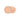 Translucent jar holds beige setting powder, which spills onto a white surface.
