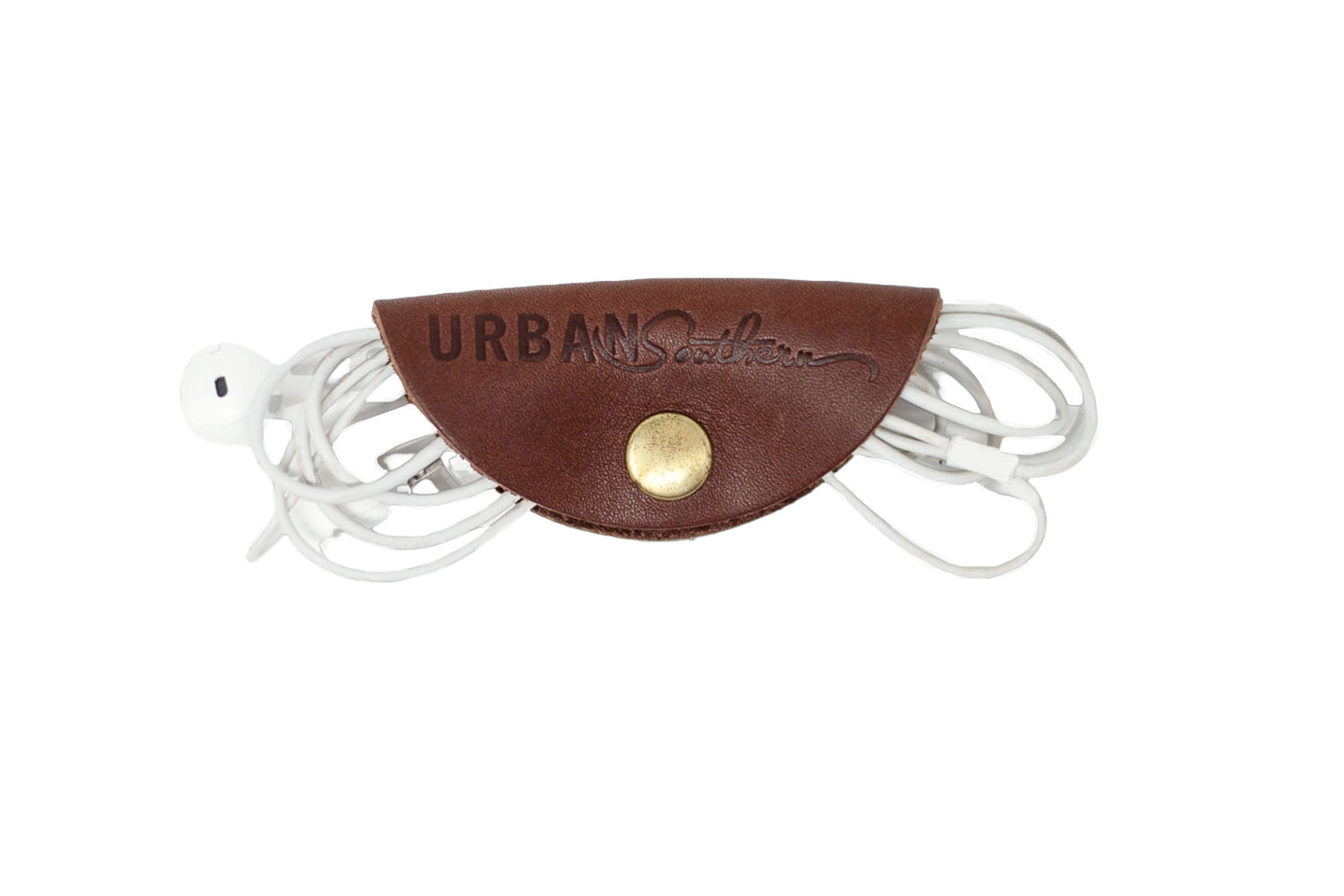 "Urban Southern's leather cord organizer neatly holds white earphones."
