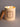 Two flames burn atop a VanMan's Old Fashioned tallow and beeswax candle with a cork lid resting beside it.
