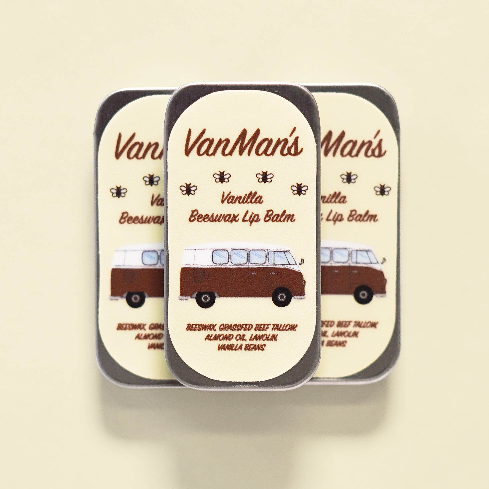 Three tins of VanMan's Vanilla Beeswax Lip Balm display a vintage van illustration.