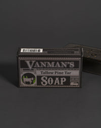 Vanman's Tallow Pine Tar Soap box displays a rustic design featuring a cow and pine trees.
