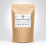 Examine a kraft paper bag showcasing Rustic Strength Epic Washing Soda, highlighting its unscented, hypoallergenic, and eco-friendly laundry cleaning benefits.