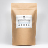 A kraft paper bag displays Epic Washing Soda laundry booster, promoting its unscented, hypoallergenic, and biodegradable qualities for eco-friendly cleaning.
