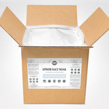 Open cardboard box reveals bulk unscented Epsom salt soak, a natural skin moisturizer, for soothing aches and exfoliating, from Rustic Strength.
