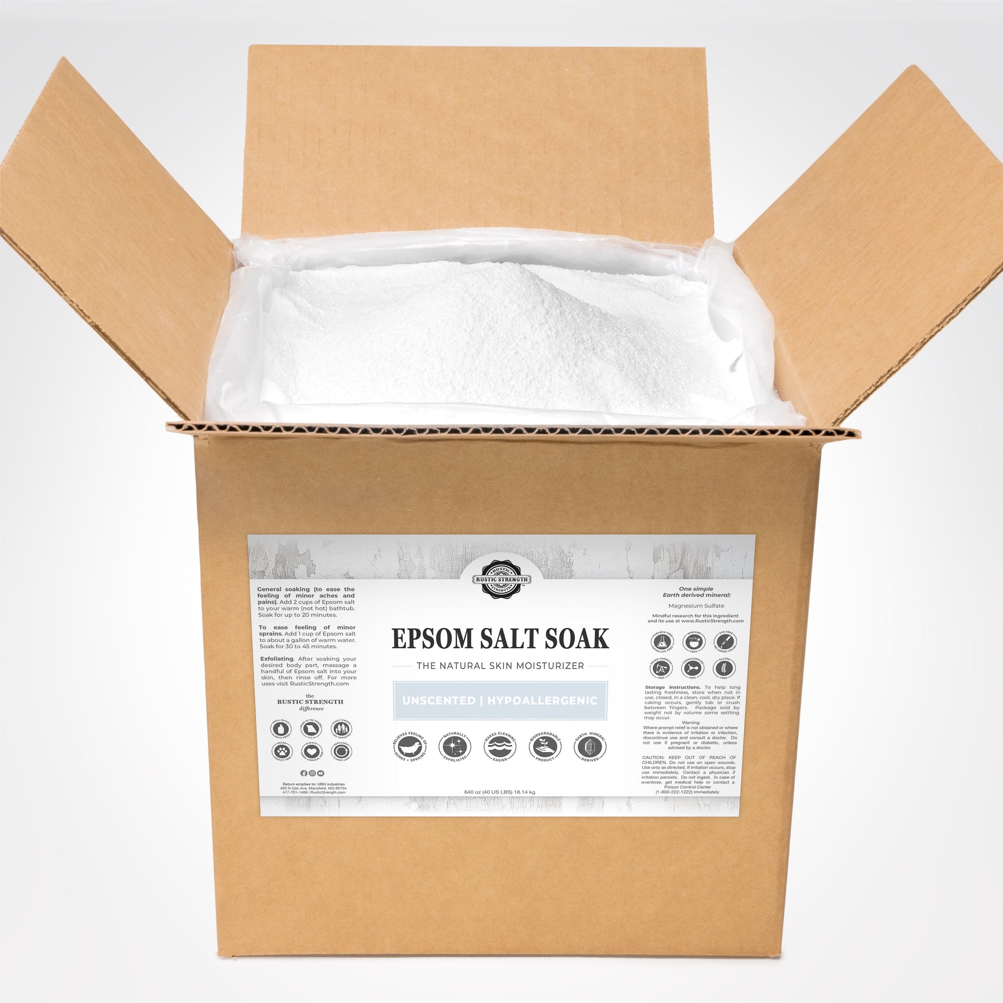 Open cardboard box reveals bulk unscented Epsom salt soak, a natural skin moisturizer, for soothing aches and exfoliating, from Rustic Strength.