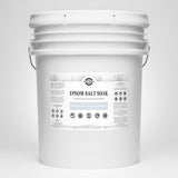 View a large white bucket containing Rustic Strength Epsom Salt Soak, an unscented and hypoallergenic natural skin moisturizer.
