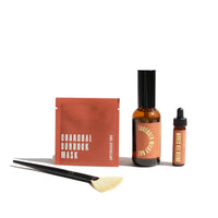 Urb. Apothecary presents a skincare set including a charcoal burdock mask, lavender milky oat serum, green tea serum, and applicator brush.
