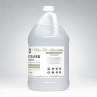 A gallon jug displays plant-based floor cleaner concentrate with tea tree essential oils, emphasizing toxin-free and powerful cleaning.
