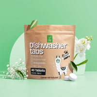 A bag of Green Llama dishwasher tabs advertises its plastic-free, fragrance-free, biodegradable, and non-toxic formula alongside a cute llama illustration.
