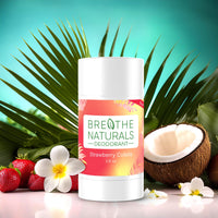 Breathe Naturals Strawberry Colada deodorant sits amongst strawberries, coconut, and tropical flowers, promoting its natural ingredients.
