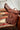 Brown leather Urban Southern backpack on a patterned surface