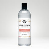 Bottle displays Rustic Strength floor cleaner concentrate with lemon lime orange and grapefruit essential oils.
