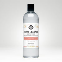 Bottle displays Rustic Strength floor cleaner concentrate with lemon lime orange and grapefruit essential oils.
