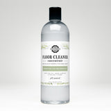 Bottle displays Rustic Strength floor cleaner concentrate, a plant-based, rosemary mint and tea tree essential oil cleaning product.

