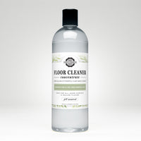 Bottle displays Rustic Strength floor cleaner concentrate, a plant-based, rosemary mint and tea tree essential oil cleaning product.
