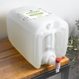 A large container of natural bergamot and cypress floor cleaner concentrate sits on a wooden shelf.

