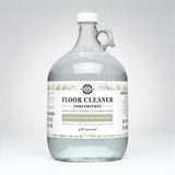 Rustic Strength markets their gallon jug of plant-based floor cleaner concentrate with rosemary mint and tea tree essential oils.
