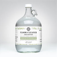 Rustic Strength markets their gallon jug of plant-based floor cleaner concentrate with rosemary mint and tea tree essential oils.