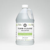 A bottle of Rustic Strength plant-based floor cleaner concentrate boasts bergamot and cypress essential oils.
