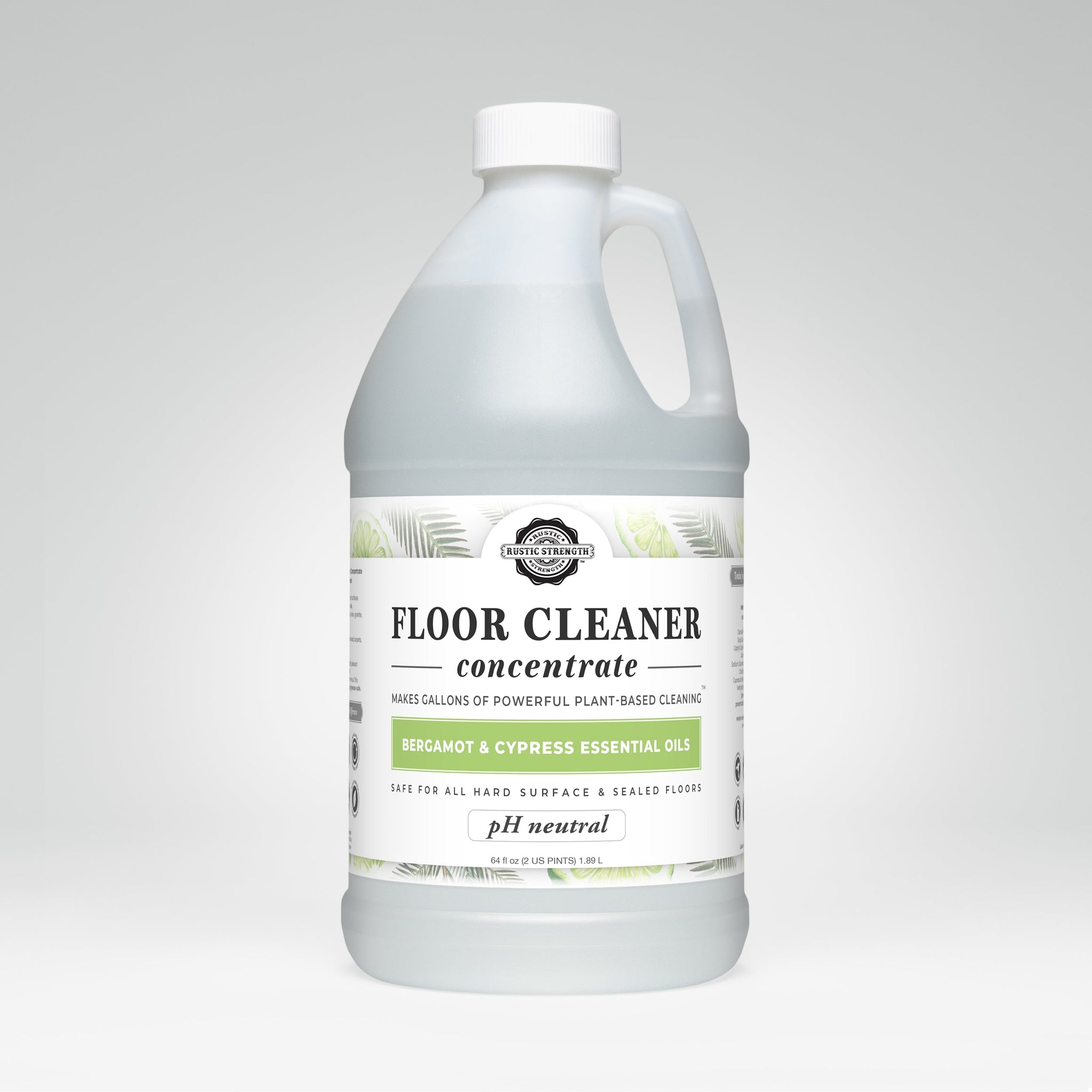 A bottle of Rustic Strength plant-based floor cleaner concentrate boasts bergamot and cypress essential oils.
