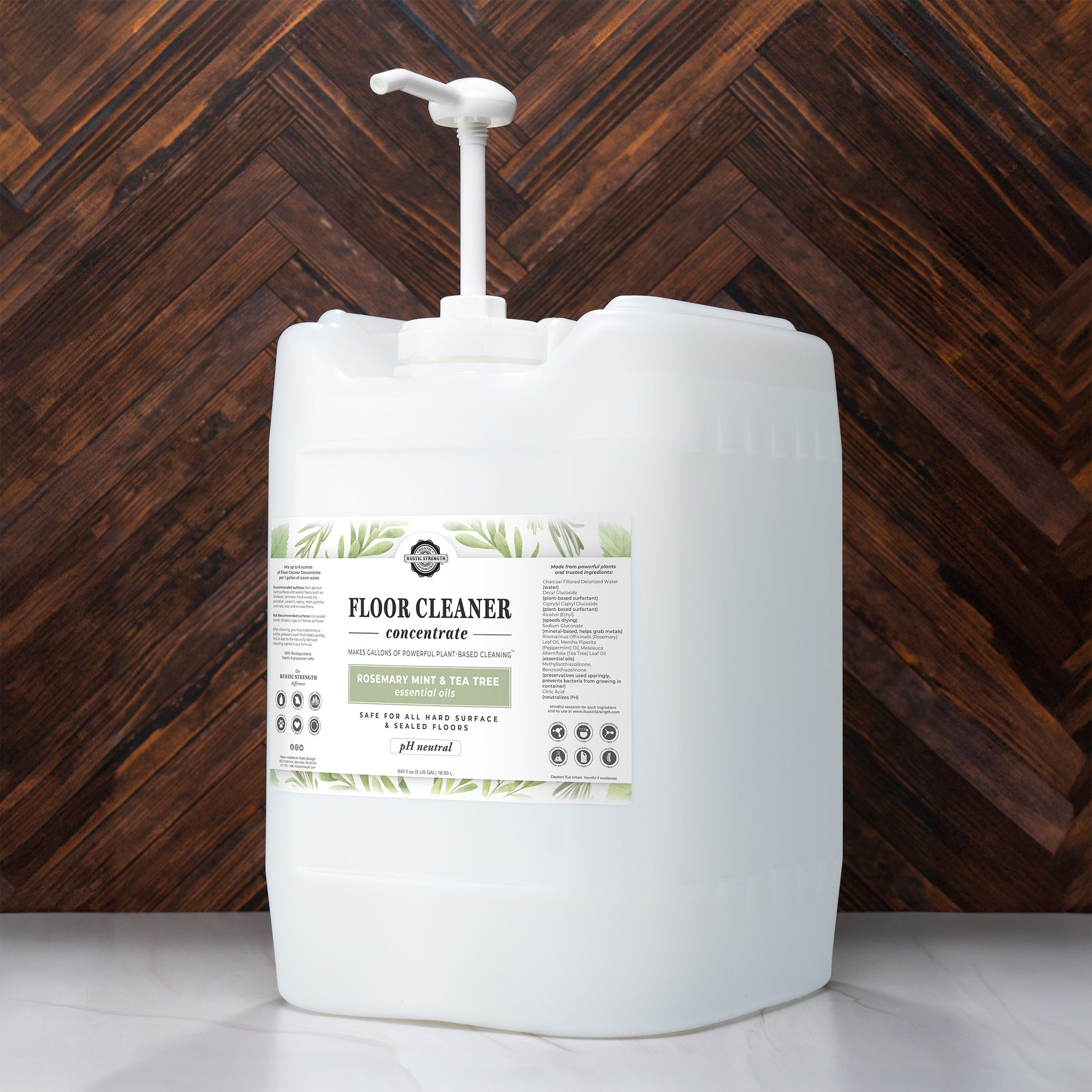 Rustic Strength presents its five-gallon floor cleaner concentrate with rosemary, mint, and tea tree essential oils, boasting plant-based cleaning and pH neutrality.
