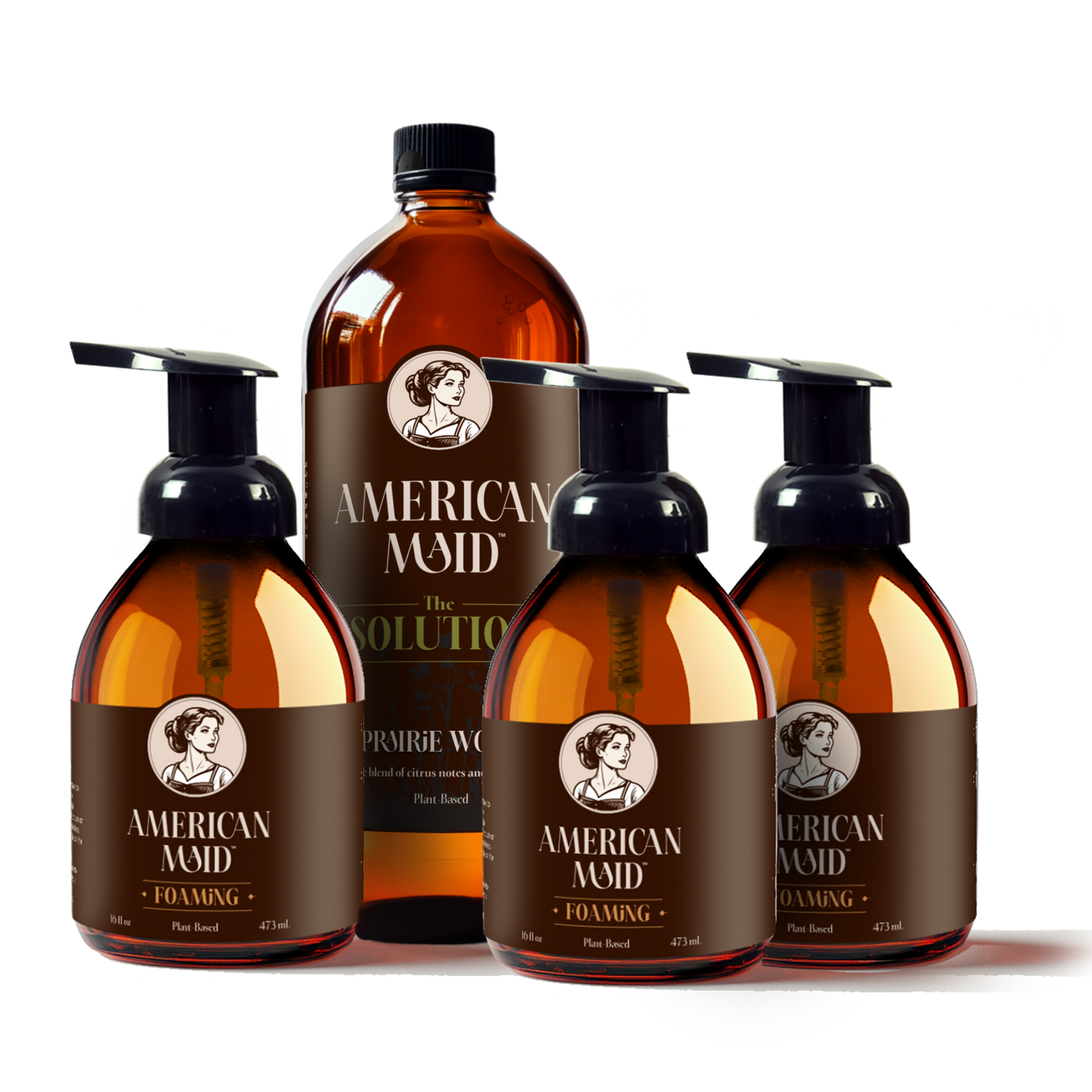 American Maid's plant-based foaming hand soap and all-purpose cleaner bottles sit arranged against a black background.
