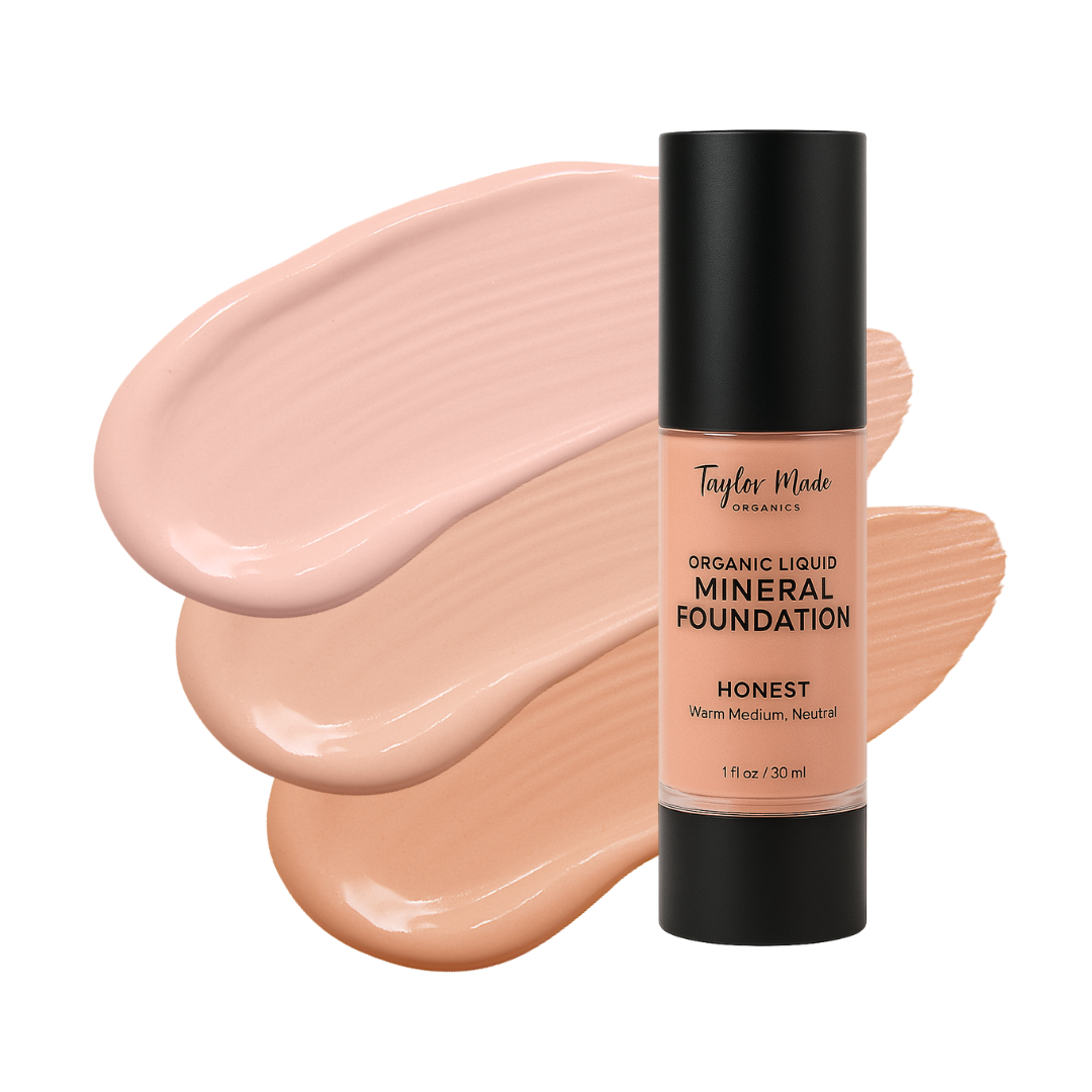 Taylor Made organic mineral foundation bottle sits beside swatches of its warm medium neutral tones.
