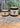 Two jars of Rowe Naturals grass-fed whipped tallow lavender skincare product sit among scattered dried lavender buds.