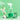 Green Llama bathroom cleaner sprays against a mint green background, showcasing its eco-friendly refill packet, white flowers, and coconut.
