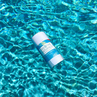 Breathe Naturals deodorant floats serenely on the surface of shimmering turquoise water.
