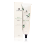 Annmarie showcases their Kaolin Micro Exfoliant cream facial scrub tube and box, highlighting their skincare product.
