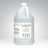A gallon jug displays toxin-free, multi-purpose cleaner made with tea tree essential oils and plant-based ingredients.
