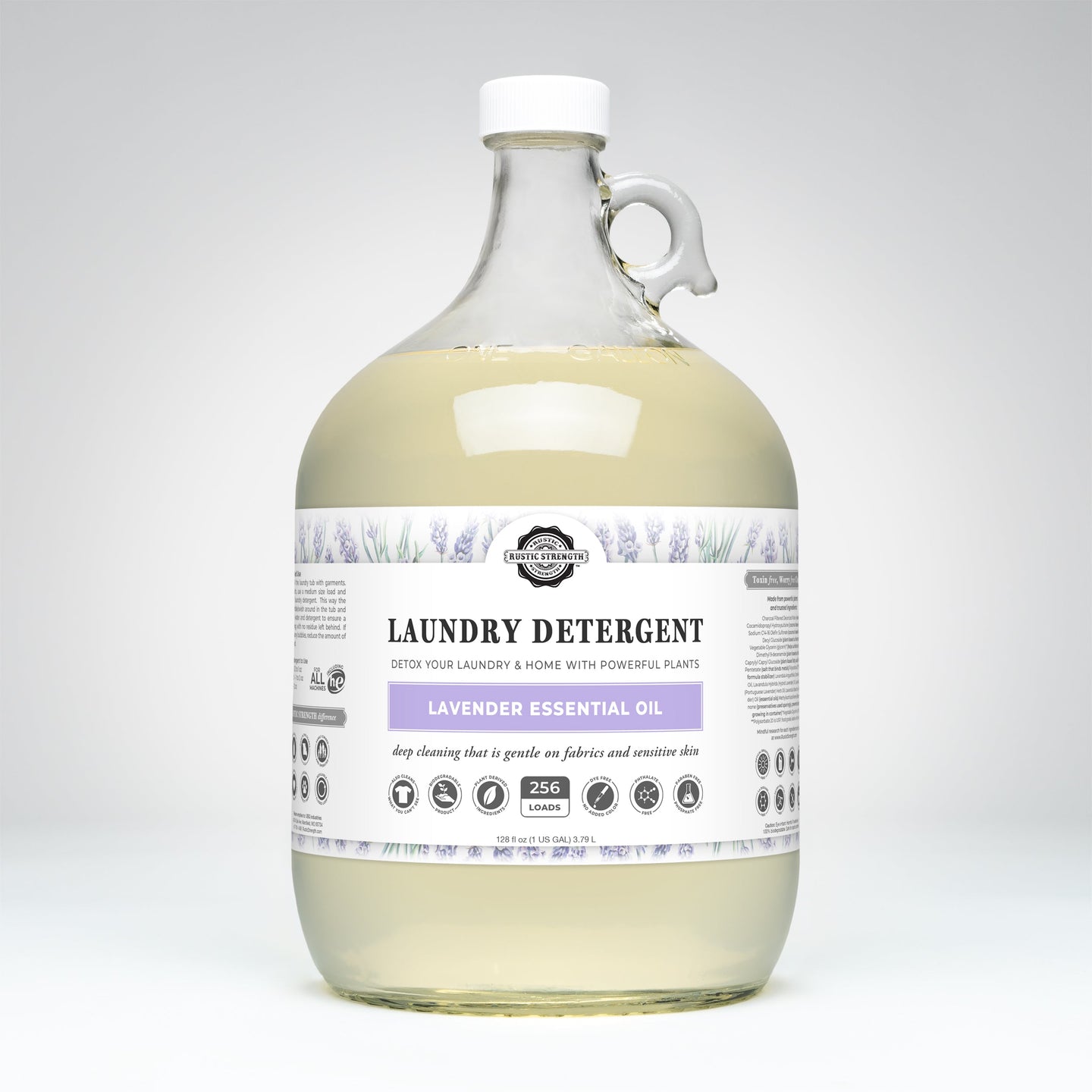 Rustic Strength lavender laundry detergent, featuring natural essential oils, sits in a clear gallon jug promising 256 loads of gentle, effective cleaning.
