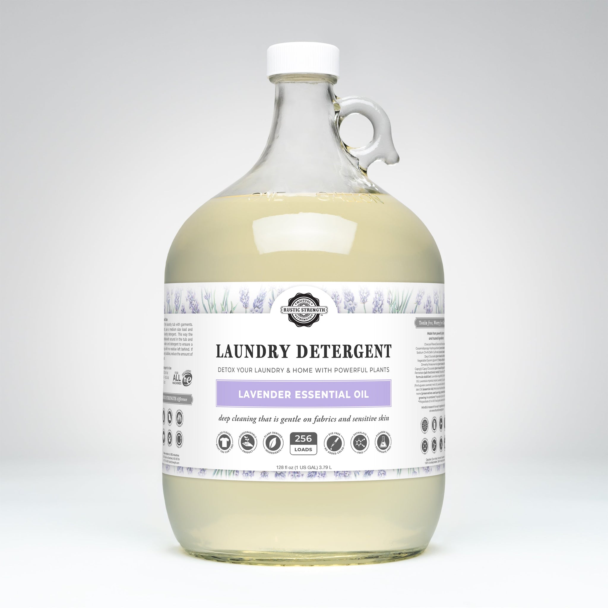 Rustic Strength lavender laundry detergent, featuring natural essential oils, sits in a clear gallon jug promising 256 loads of gentle, effective cleaning.
