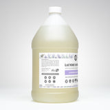 Showcases a gallon-sized bottle of Rustic Strength lavender essential oil laundry detergent.
