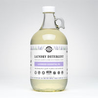 Rustic Strength Lavender Essential Oil laundry detergent fills a glass jug with handle.
