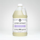 A bottle of Rustic Strength laundry detergent advertises lavender essential oil for deep cleaning and sensitive skin.
