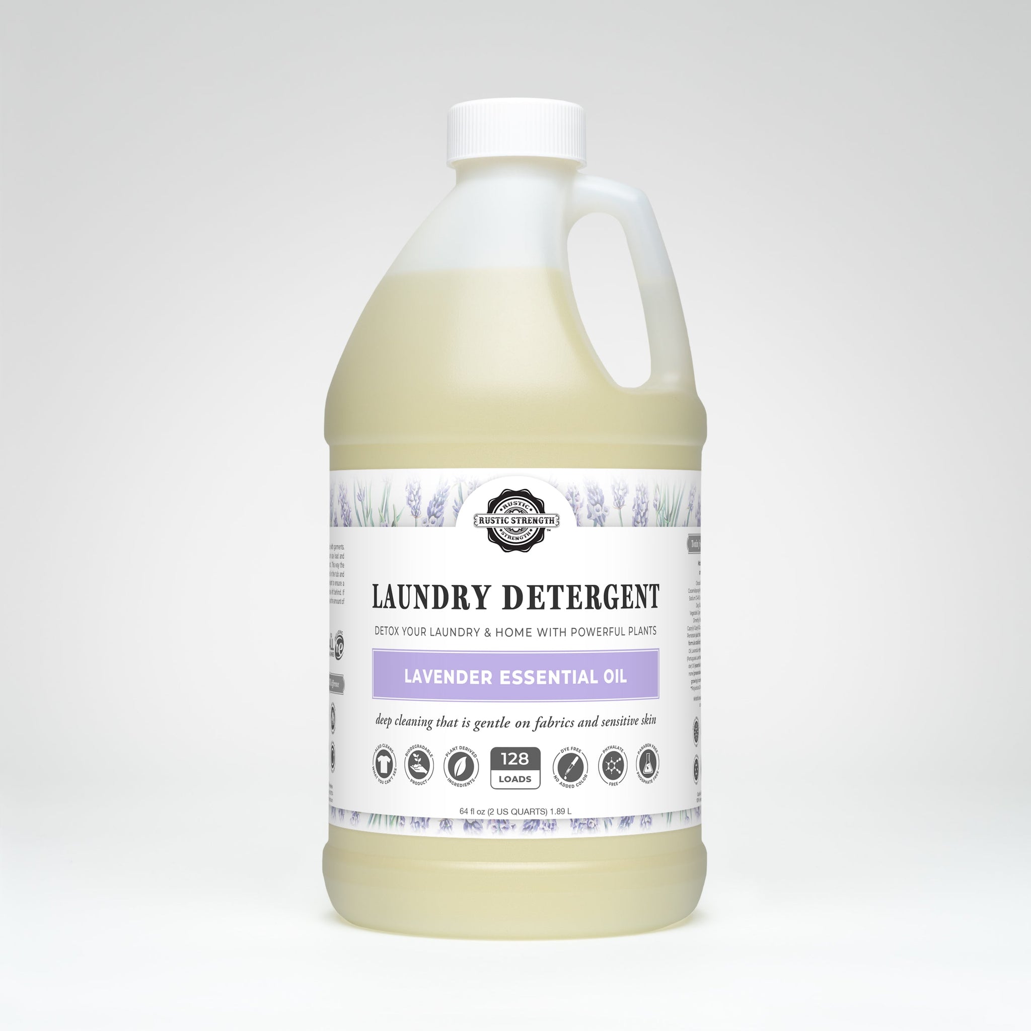 A bottle of Rustic Strength laundry detergent advertises lavender essential oil for deep cleaning and sensitive skin.
