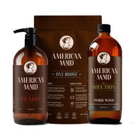 Showcasing American Maid laundry and cleaning products, including laundry detergent, oxy-boost, and prairie wood solution, emphasizing their plant-based, eco-friendly formulas.
