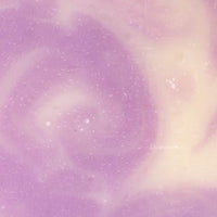 Lavender soap swirls with a creamy white, creating a soothing marble effect.
